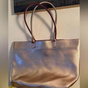 Rose gold bag with 2 handles and zipper closure by Bath and Body works